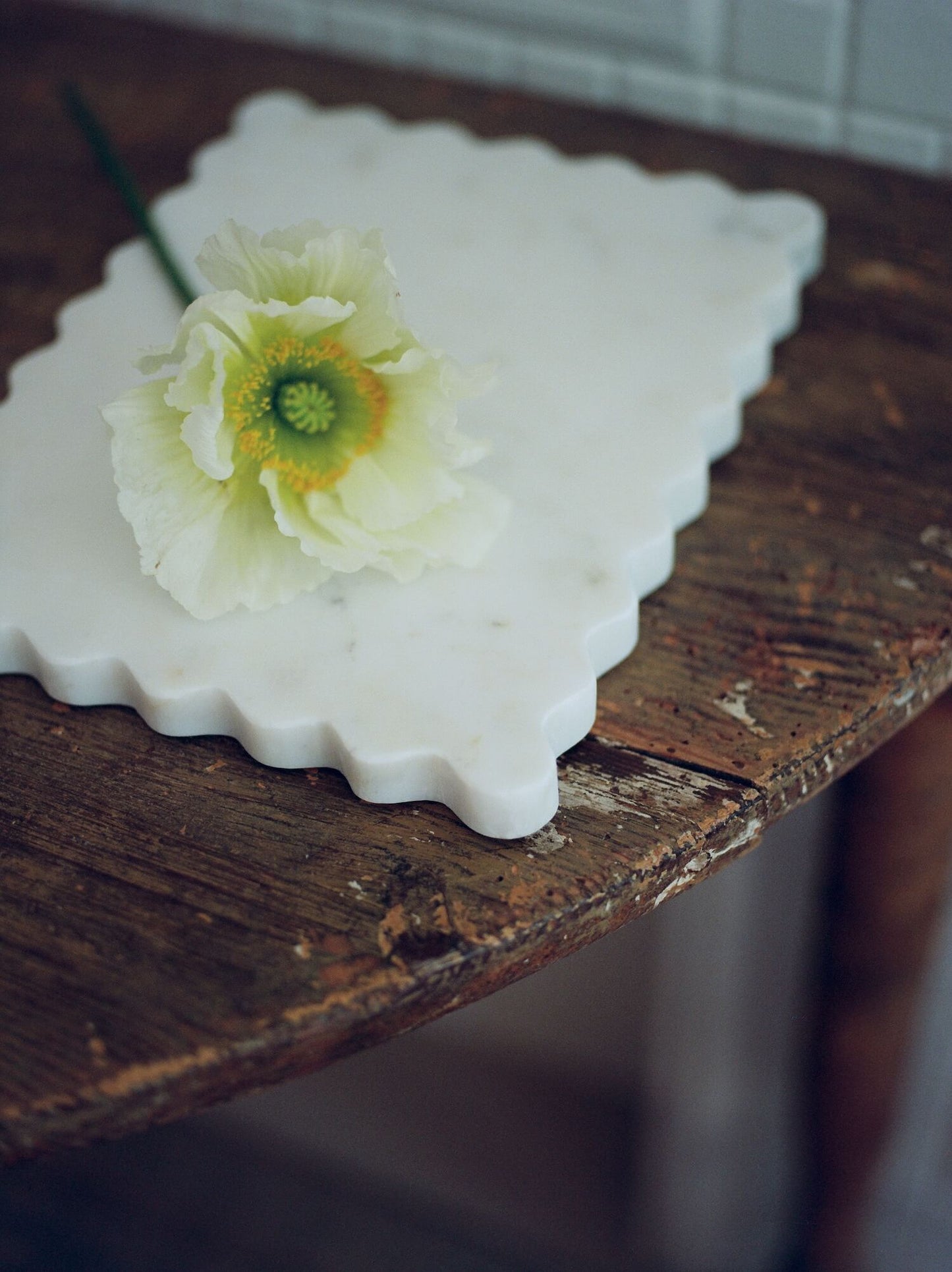 A petite scalloped slab on a table